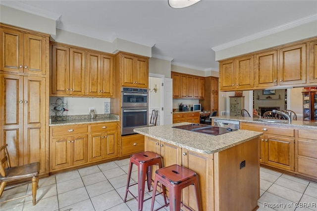kitchen featuring stainless steel double oven, light tile patterned flooring, a sink, black electric stovetop, and a center island