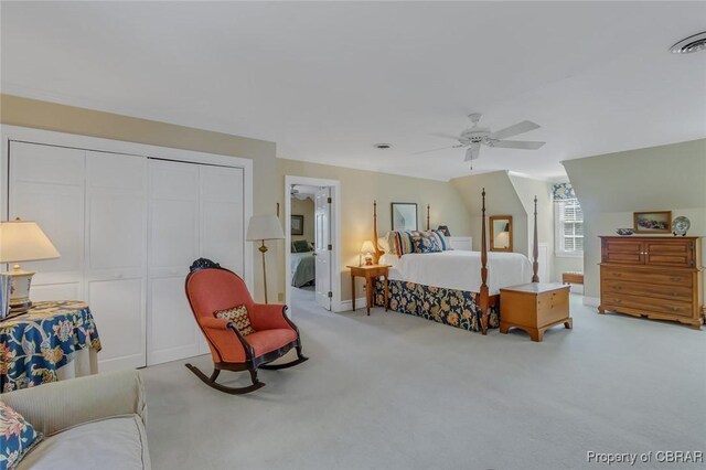 carpeted bedroom with visible vents, a closet, and ceiling fan