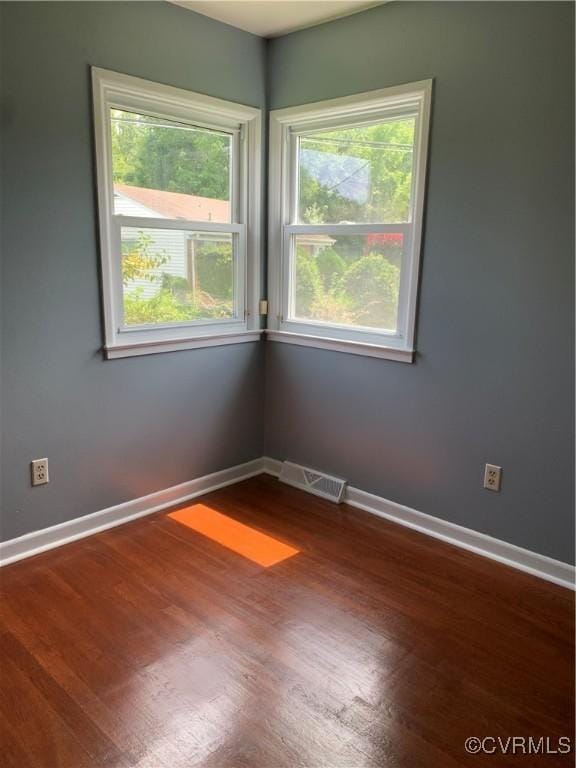 empty room with wood-type flooring