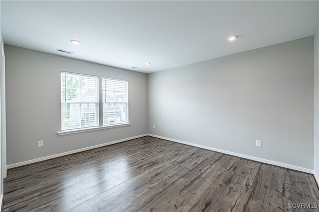 empty room with dark hardwood / wood-style floors