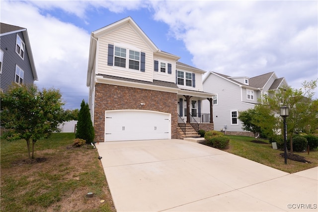 view of front facade featuring a garage and a front yard