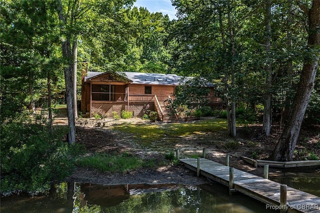 back of property with stairway and a wooden deck