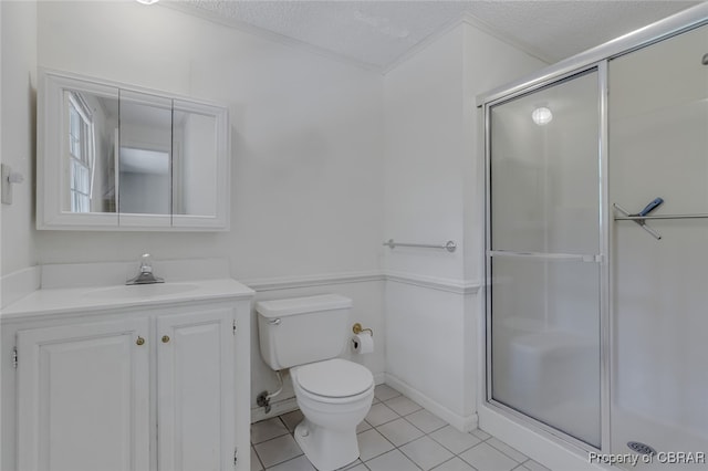 bathroom featuring vanity, walk in shower, a textured ceiling, and toilet