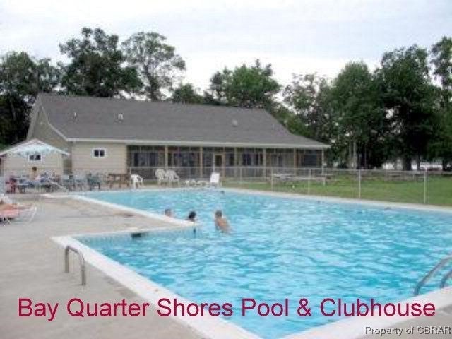 community pool featuring a patio area and fence