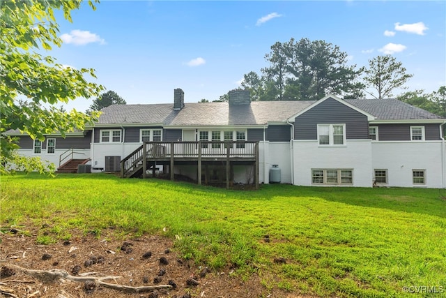 back of house with a yard and a wooden deck