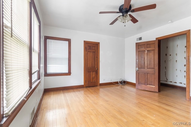 unfurnished bedroom with light wood-type flooring and ceiling fan