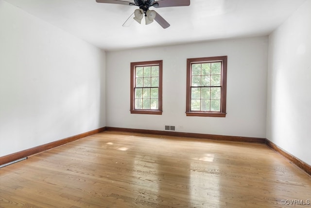 empty room featuring light hardwood / wood-style floors and ceiling fan