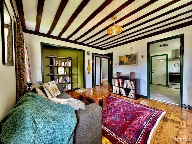 tiled living room with beam ceiling