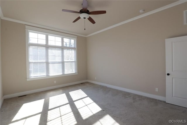 unfurnished room with ceiling fan, ornamental molding, and light carpet