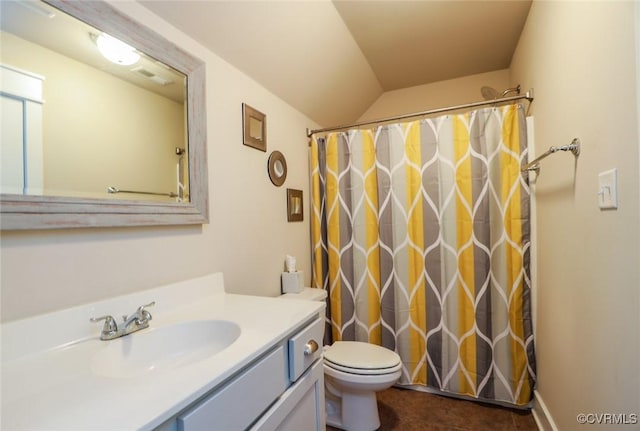 bathroom featuring curtained shower, lofted ceiling, tile patterned flooring, vanity, and toilet