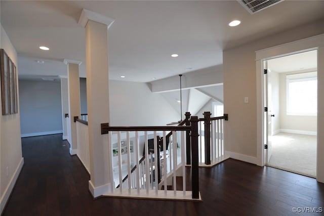 hall featuring dark wood-type flooring and lofted ceiling