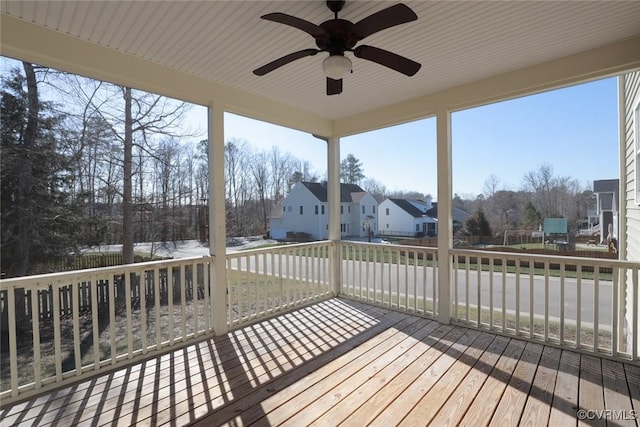 wooden terrace featuring ceiling fan