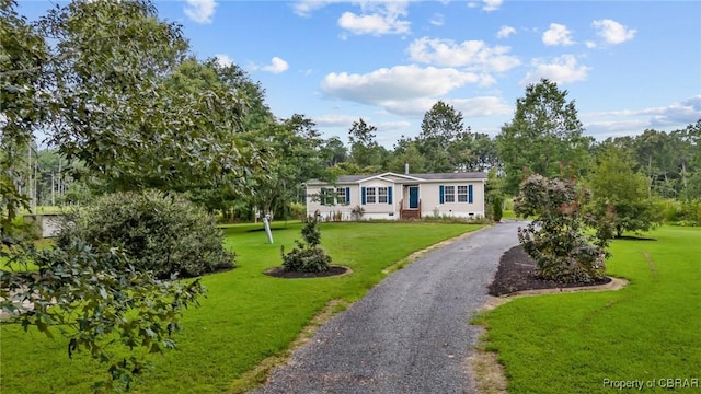 view of front facade with aphalt driveway, a front yard, and crawl space