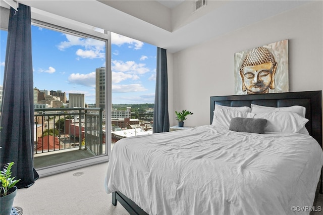 bedroom with multiple windows and carpet flooring