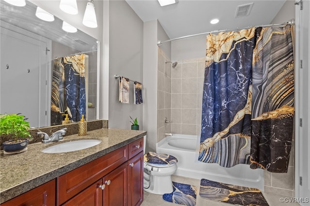 full bathroom with vanity, shower / bath combo with shower curtain, toilet, and tile patterned floors