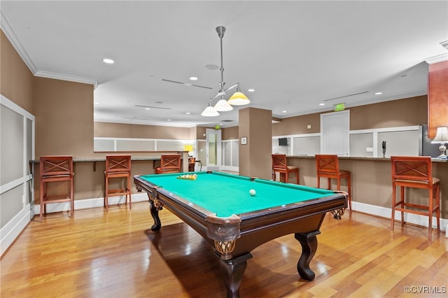 rec room with light hardwood / wood-style floors, crown molding, and billiards