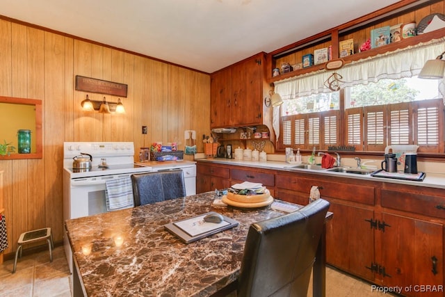 kitchen featuring light tile patterned flooring, sink, a healthy amount of sunlight, and white range with electric cooktop