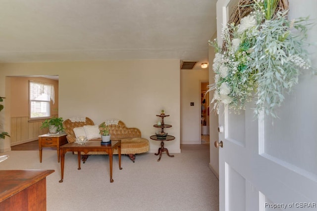 living area with light carpet