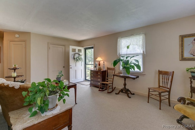 interior space featuring light colored carpet