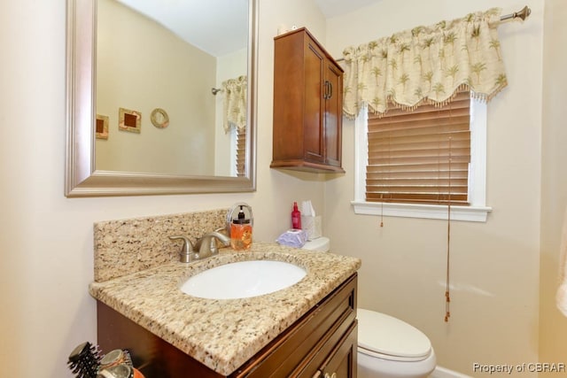 bathroom with vanity and toilet