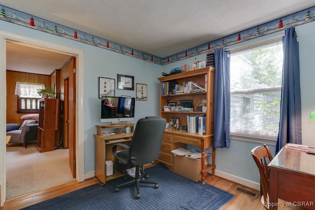 office space with light wood-type flooring