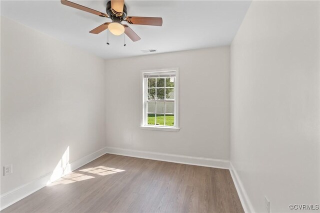 spare room featuring ceiling fan and wood-type flooring