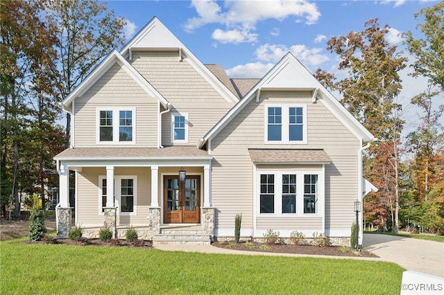 craftsman house featuring a front lawn and covered porch