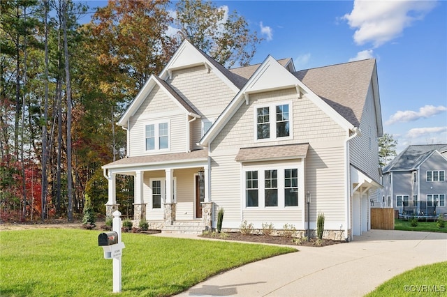 craftsman-style house featuring a porch and a front lawn