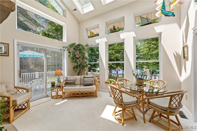 sunroom / solarium with lofted ceiling with skylight and visible vents