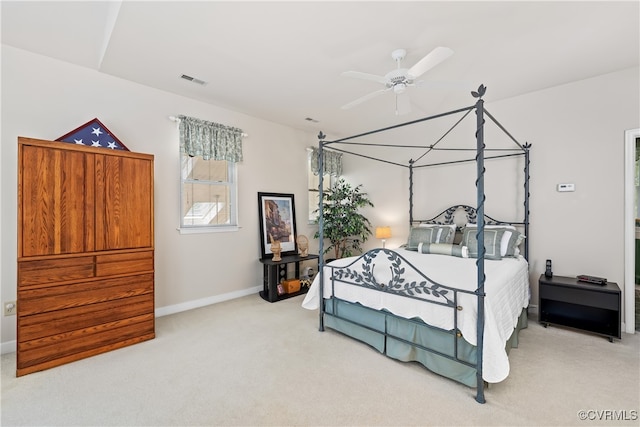 bedroom with visible vents, baseboards, carpet, and a ceiling fan