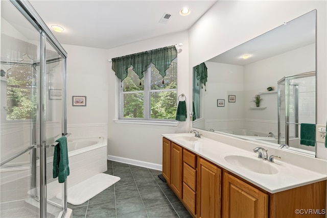 bathroom with shower with separate bathtub, tile patterned flooring, and vanity