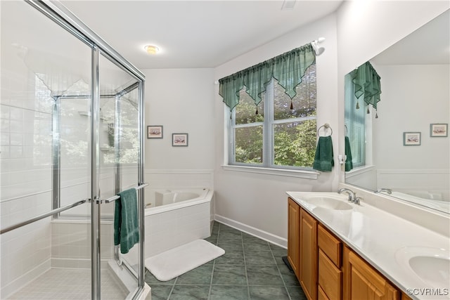 bathroom with tile patterned flooring, vanity, and separate shower and tub