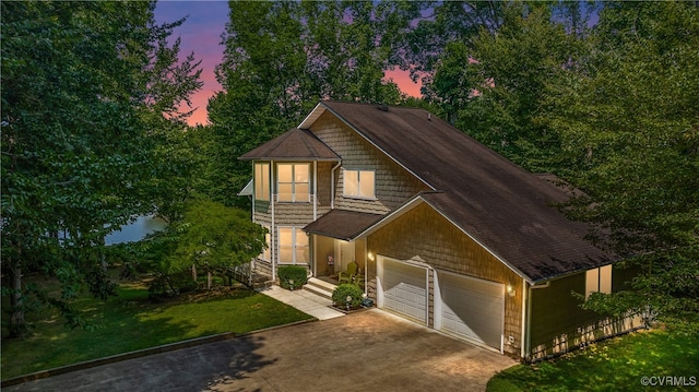 view of front of house featuring driveway and a front lawn