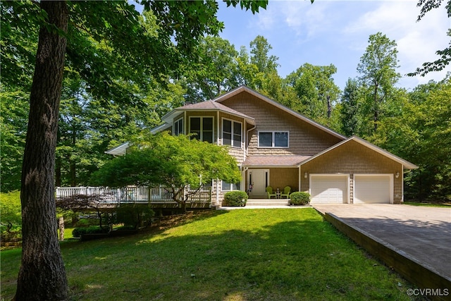 view of front of property with a garage and a front lawn