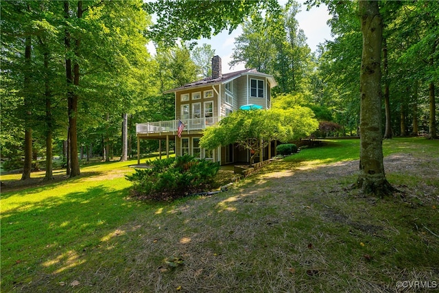 view of yard featuring a wooden deck