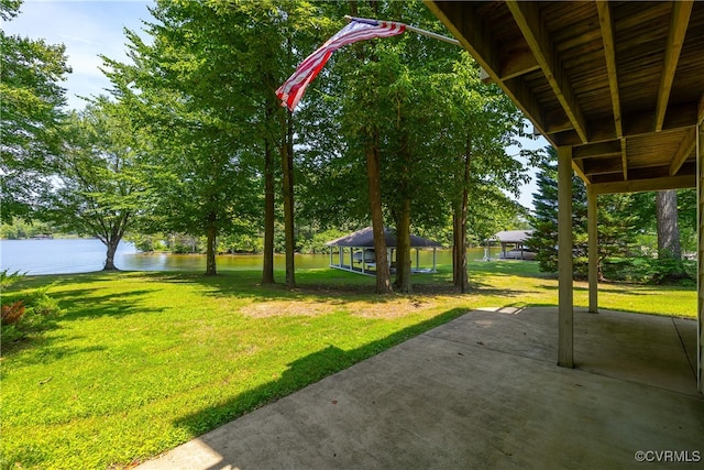 view of yard with a water view, a patio area, and a gazebo