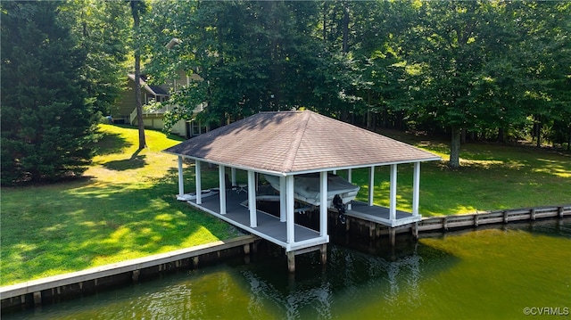 view of dock featuring a water view and a yard