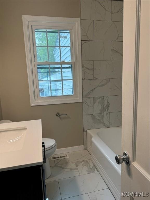 bathroom featuring visible vents, baseboards, toilet, marble finish floor, and vanity