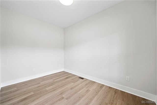 spare room with light wood-type flooring