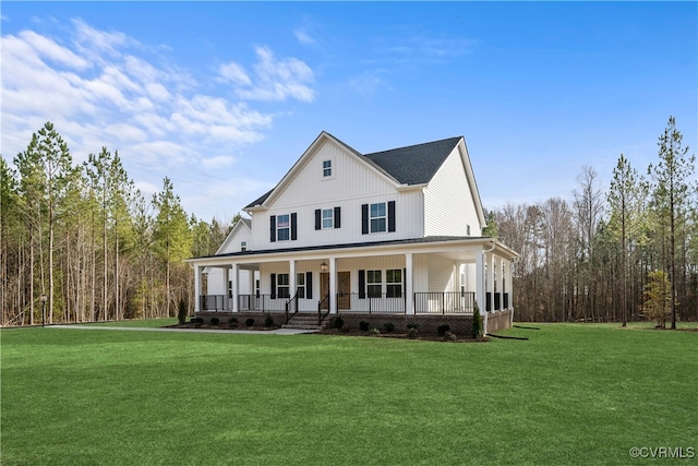 view of front of property with a front yard and covered porch