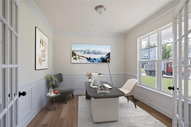 office with french doors, ornamental molding, and wood-type flooring