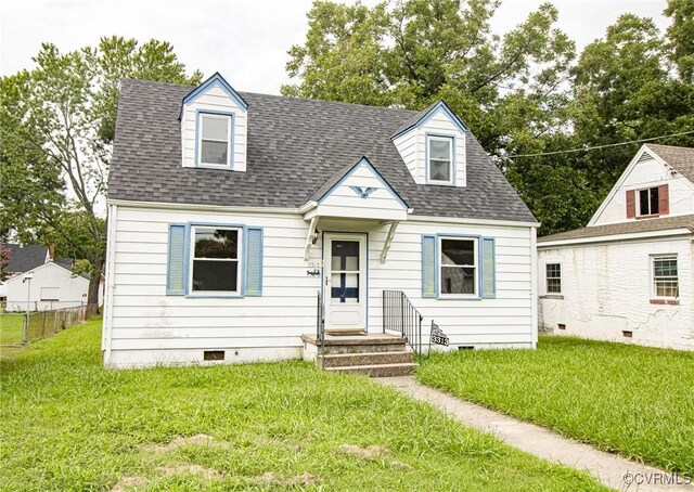 new england style home with a front yard