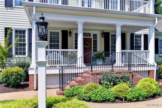 doorway to property featuring covered porch