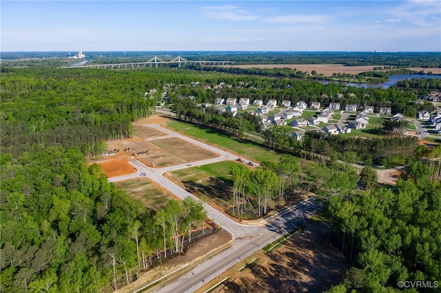 bird's eye view featuring a wooded view