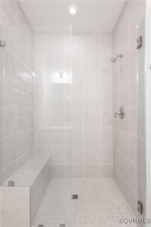 bathroom with a shower stall