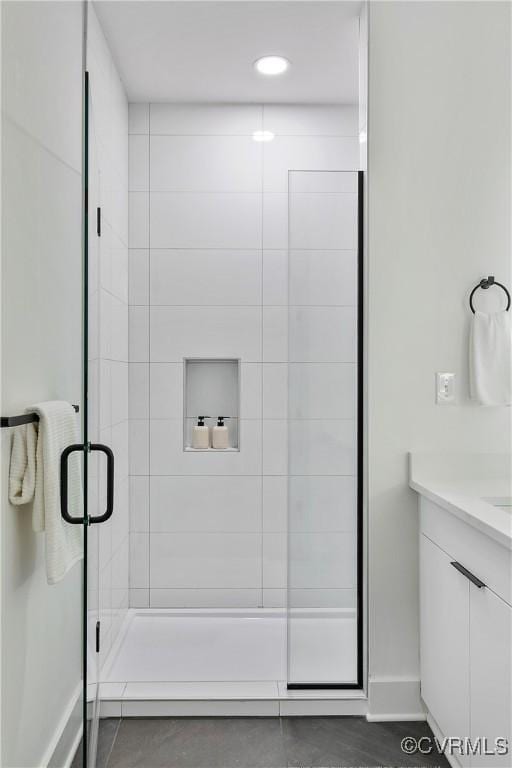 bathroom with vanity and an enclosed shower