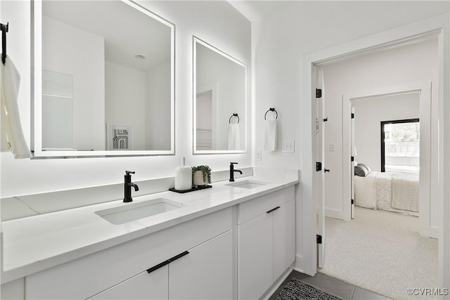 bathroom featuring tile patterned flooring and vanity