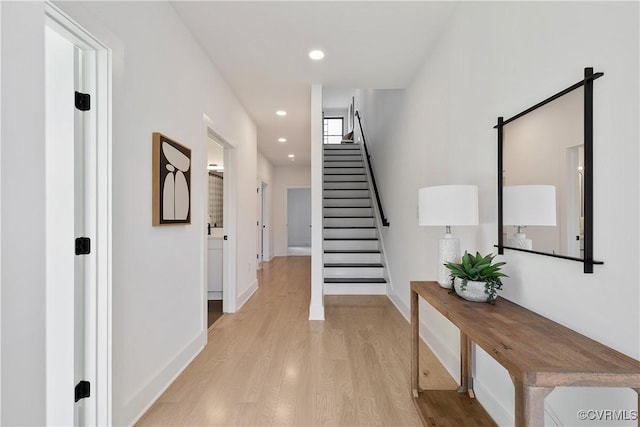 hall with light hardwood / wood-style floors