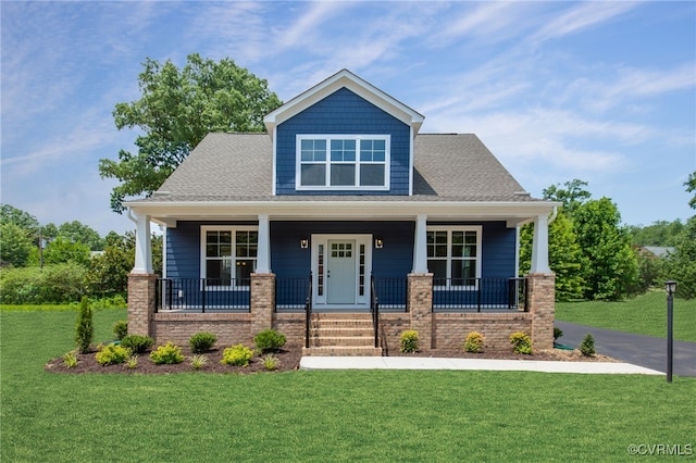 craftsman-style house with a front lawn and a porch