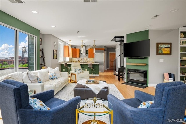 living room with light hardwood / wood-style flooring